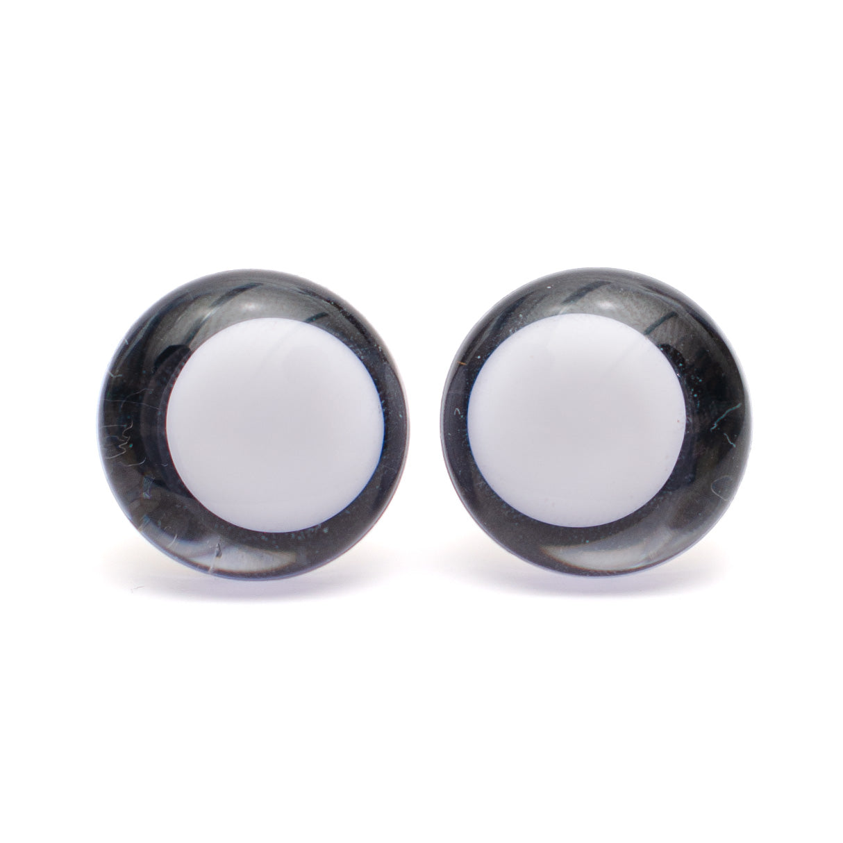 Ei keskikohtaa, turvasilmä, valkoinen pupilli - musta